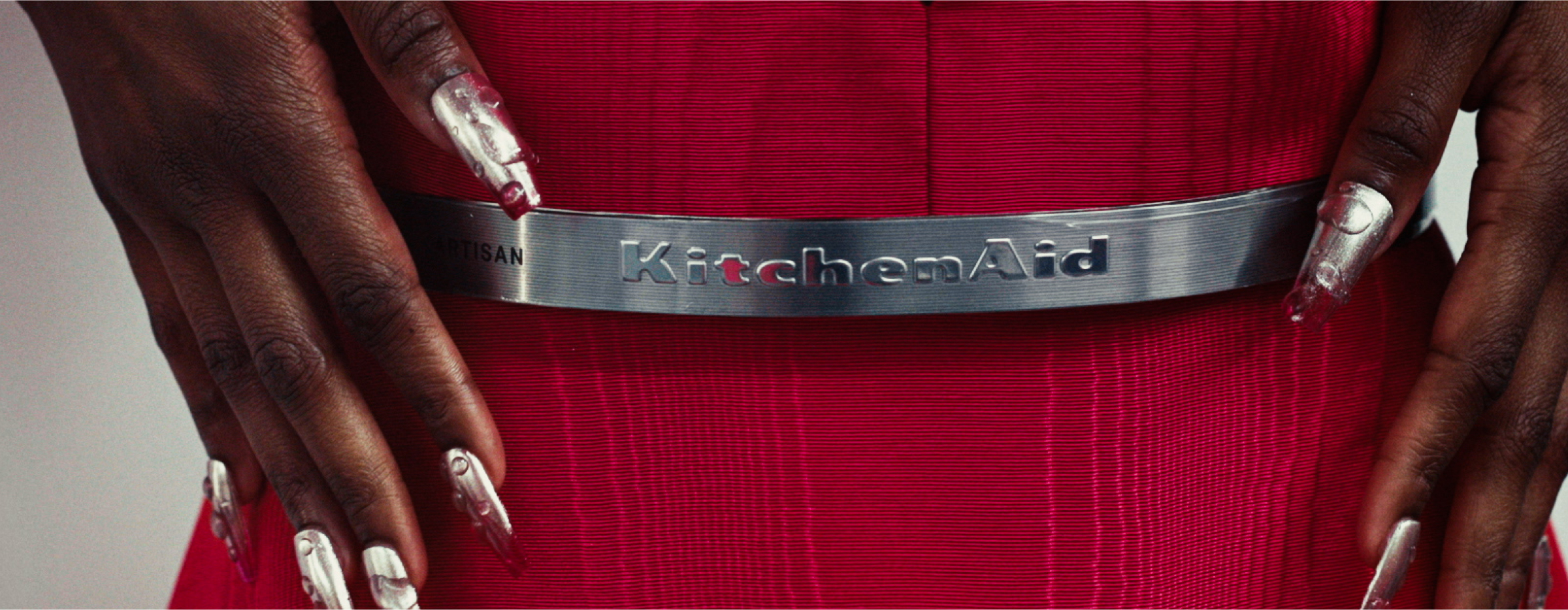 A close up of the KitchenAid® logo on a trimband belt.