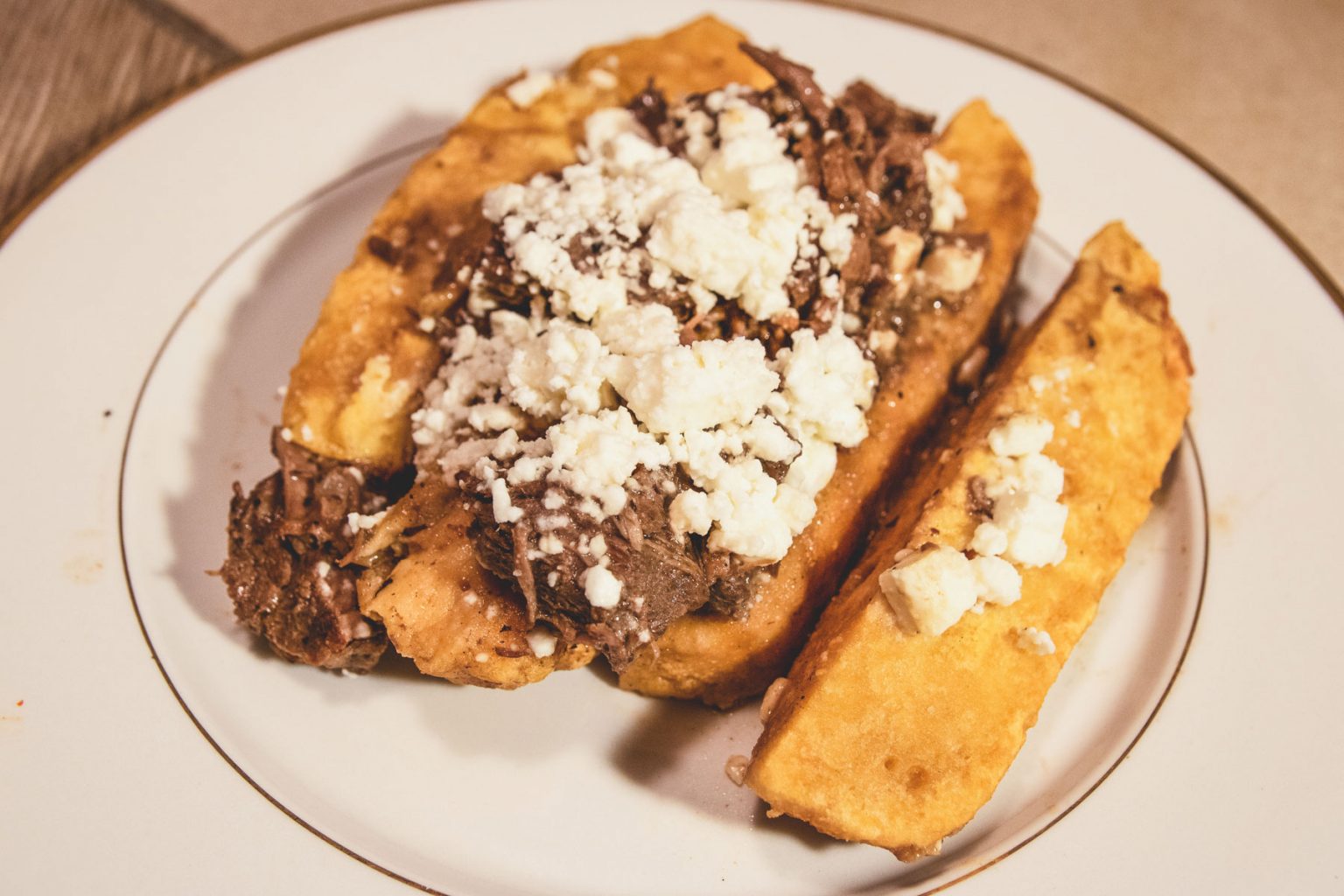 A plate of smoked sweet potato with fresh garnish and toppings.