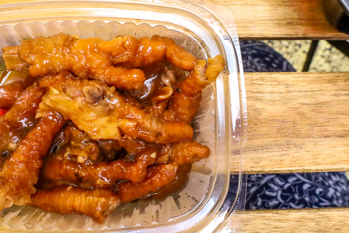 A clear container filled with delicous food.