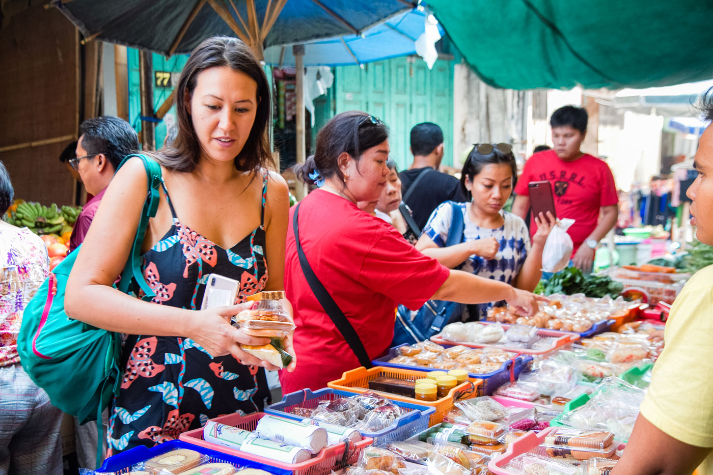 Women shopping at an outdoor market.