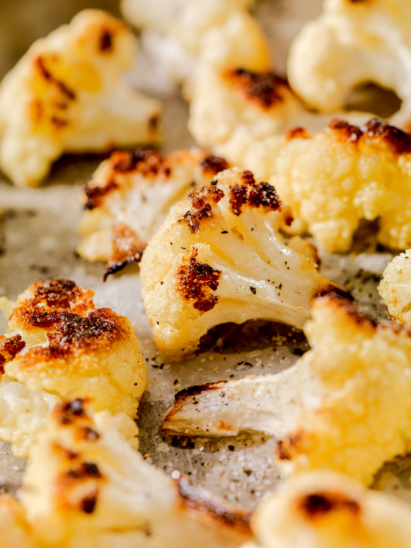 Roasted cauliflower sprinkled with seasonings.