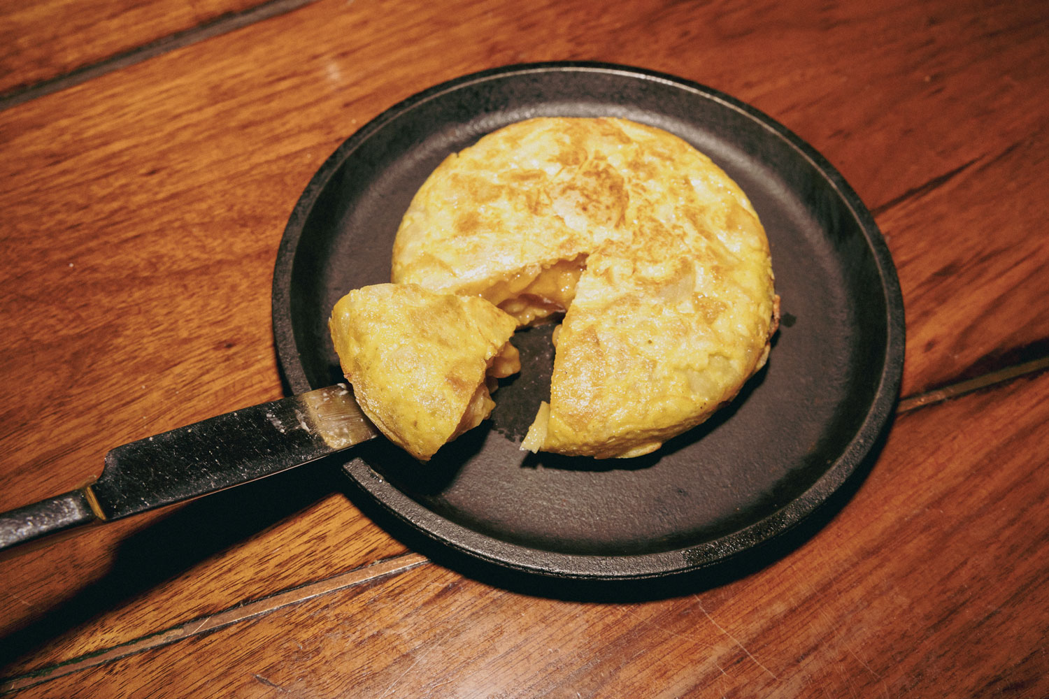 A Spanish dish on a cast iron skillet.