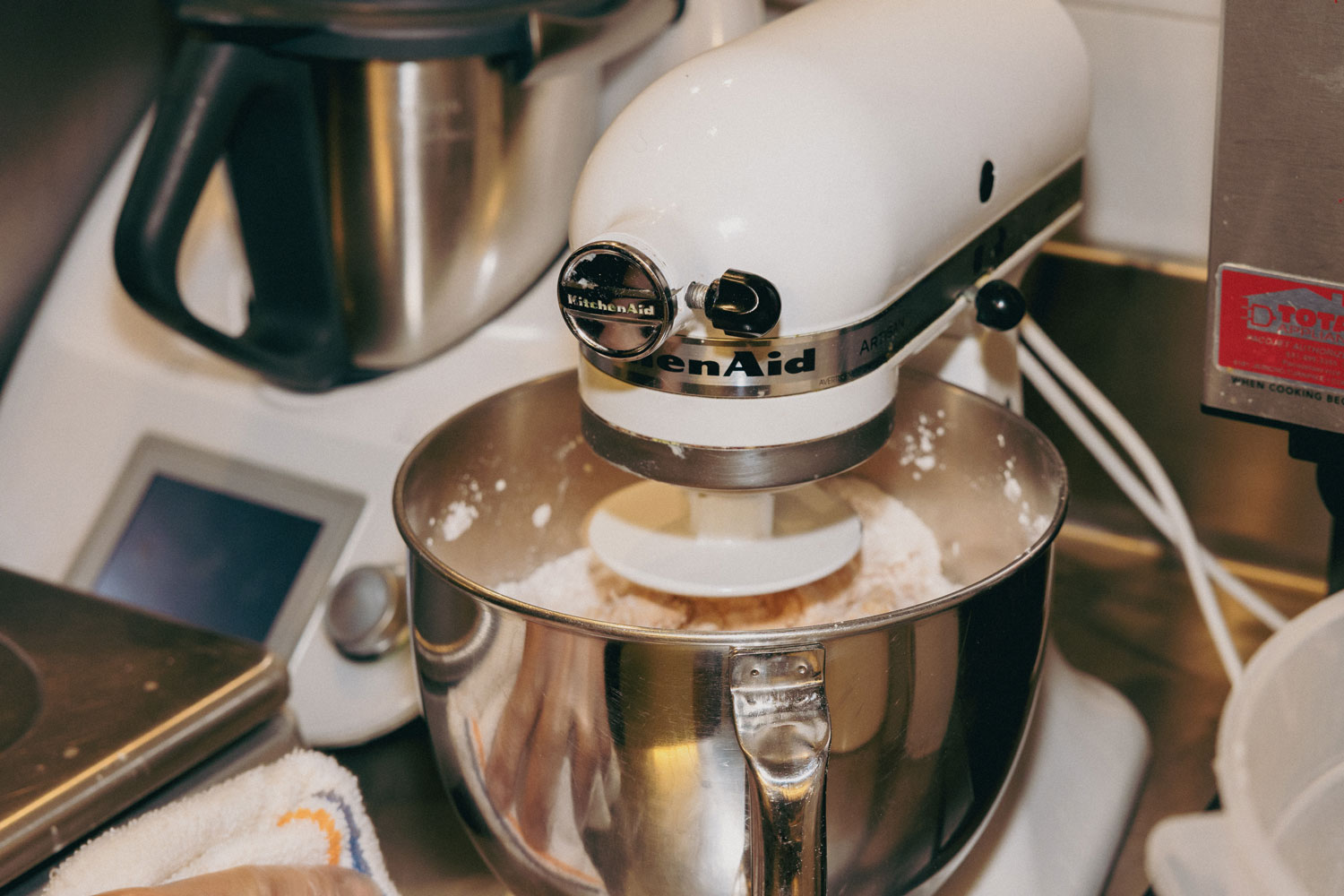 A stand mixer avidly mixing.