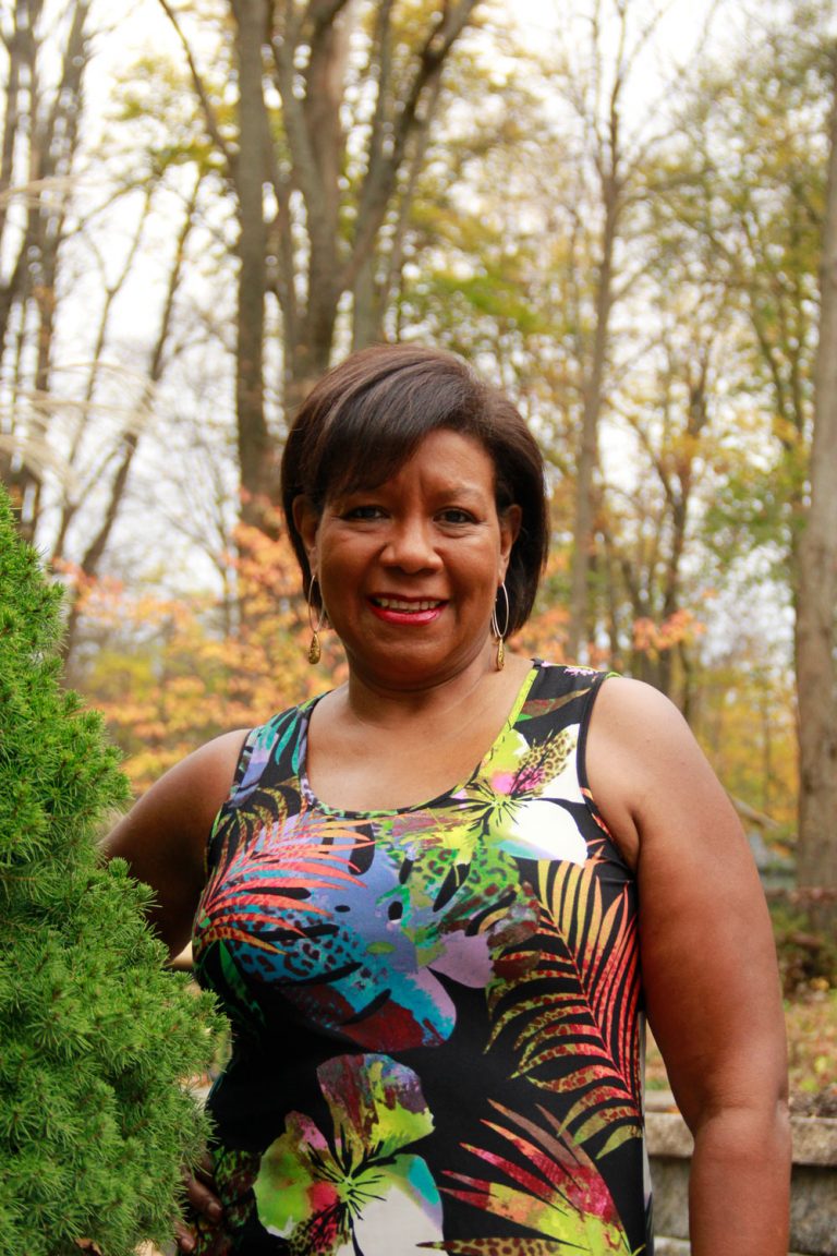 Debra Sandler happily smiling for the camera.