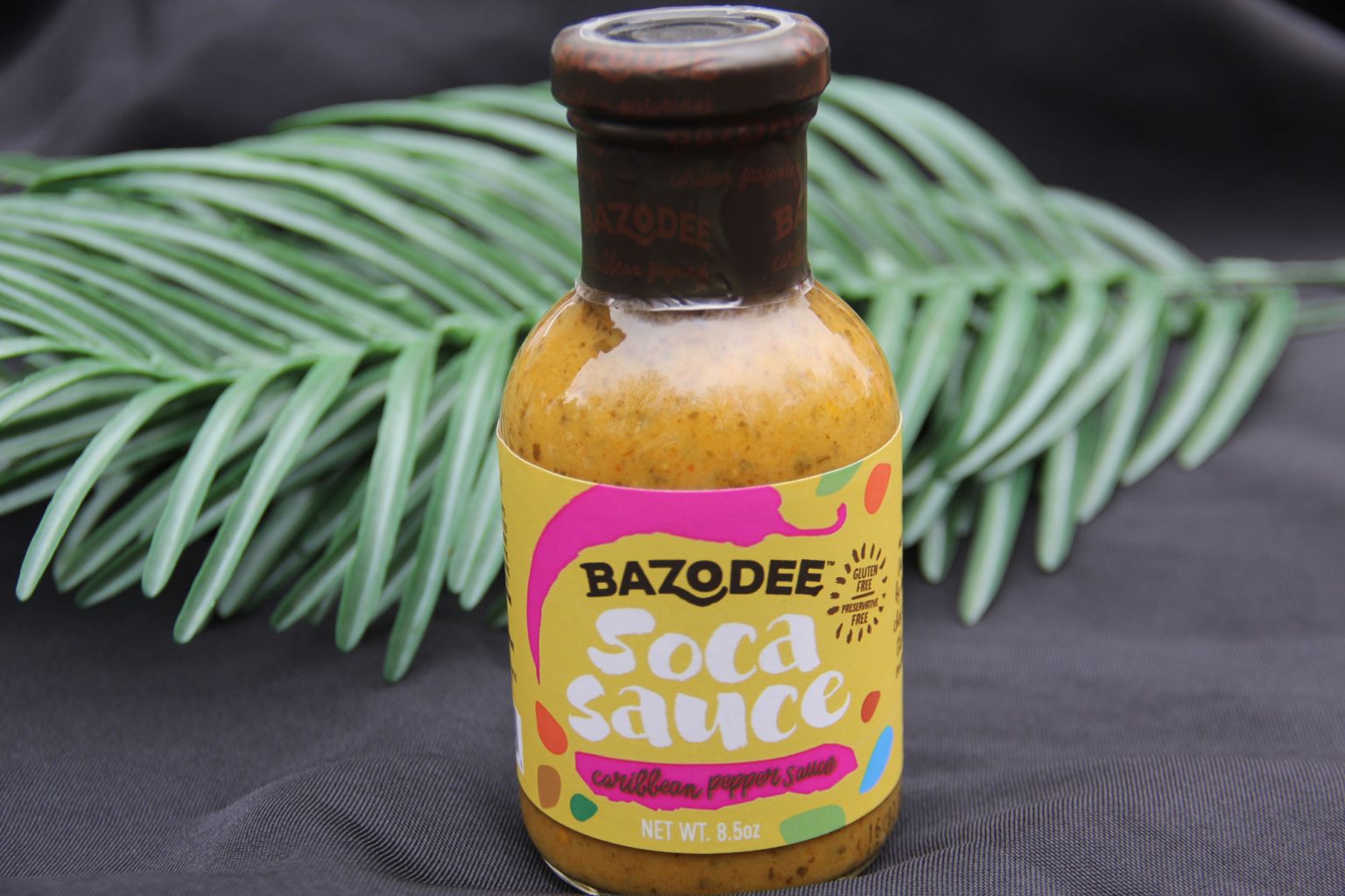 A full bottle of Bazodee Caribbean pepper sauce.