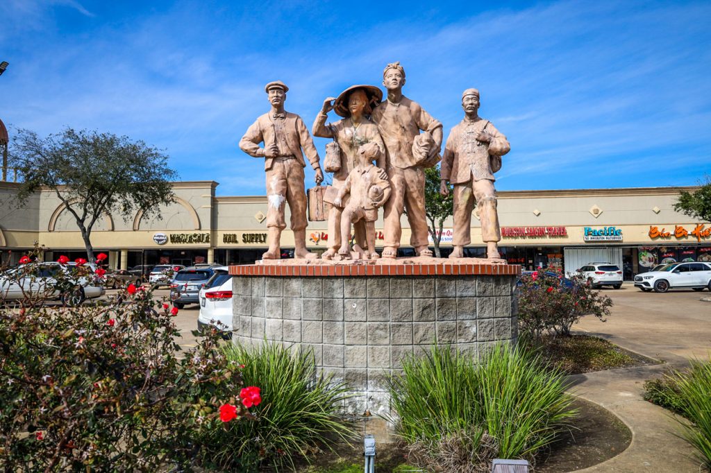 A statue of a Vietnamese refugee family.