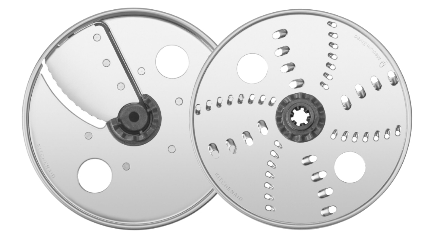Two food processor blades. Two food processor blades.