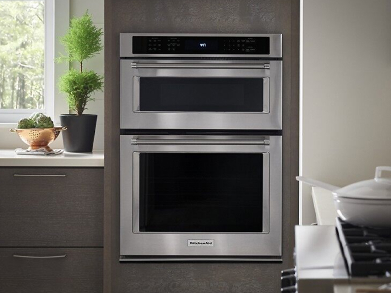 A stainless steel KitchenAid® combination wall oven. A stainless steel KitchenAid® combination wall oven.