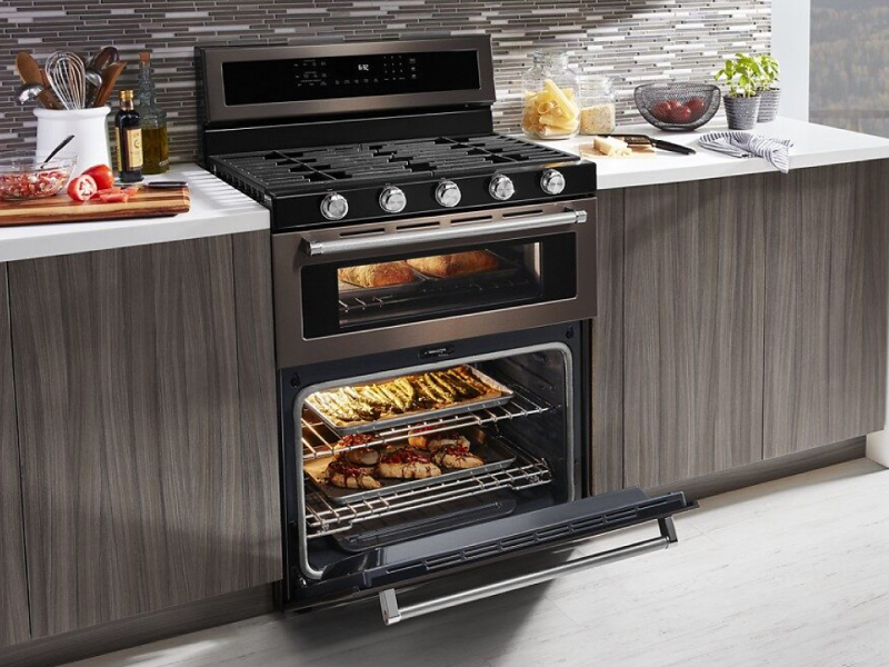 Various dishes cooking in a gas oven range Various dishes cooking in a gas oven range