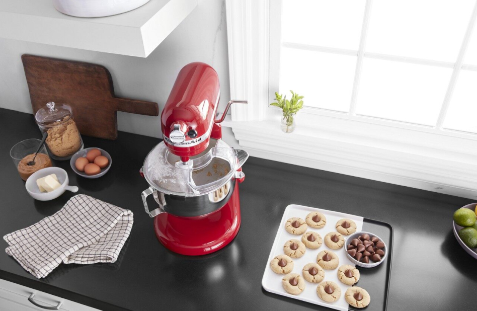 KitchenAid® stand mixer on countertop with plate of homemade cookies. KitchenAid® stand mixer on countertop with plate of homemade cookies.