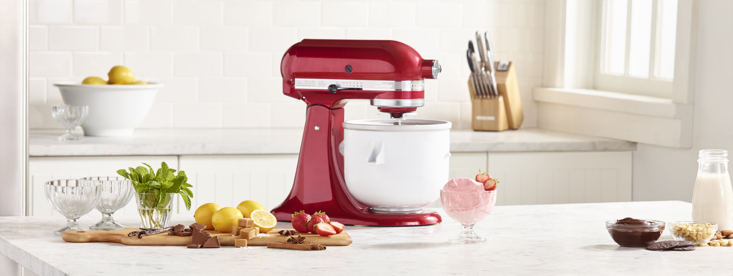 Ingredients for making homemade frozen yogurt in a KitchenAid® stand mixer.