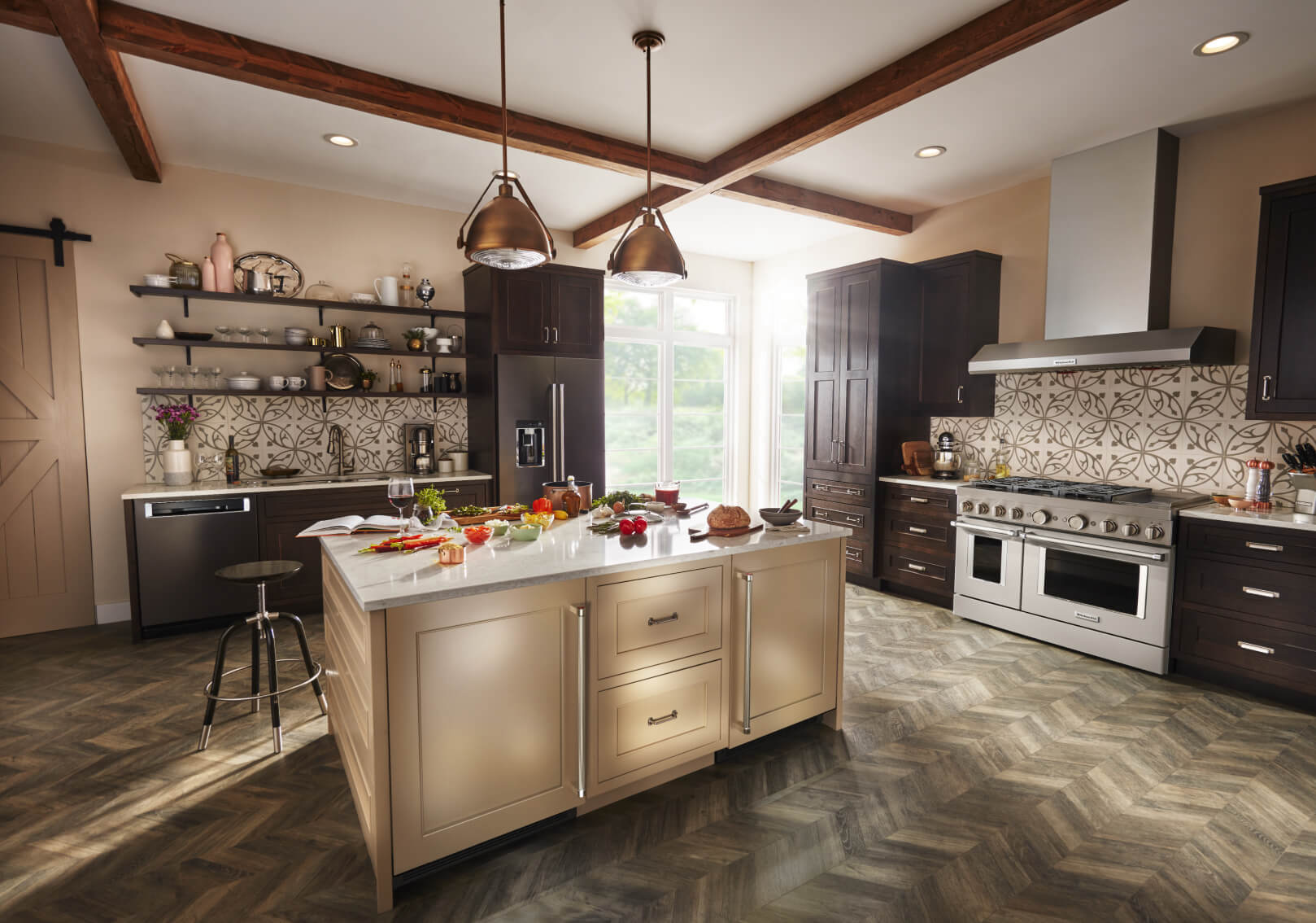 Kitchen with large island and black stainless KitchenAid® appliances. Kitchen with large island and black stainless KitchenAid® appliances.