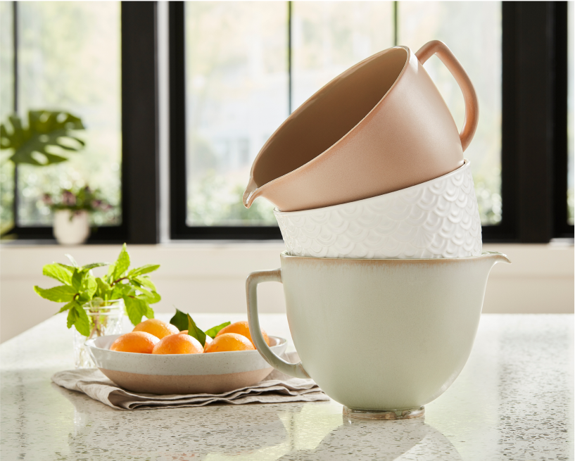 A three-stack of KitchenAid mixer bowls.