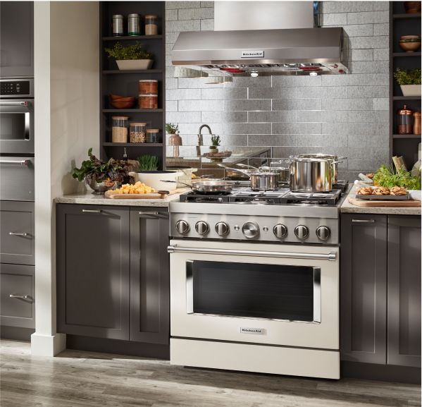 A 36'' Smart Commercial-Style Dual Fuel Range With 6 Burners in Milkshake in a modern contemporary kitchen.