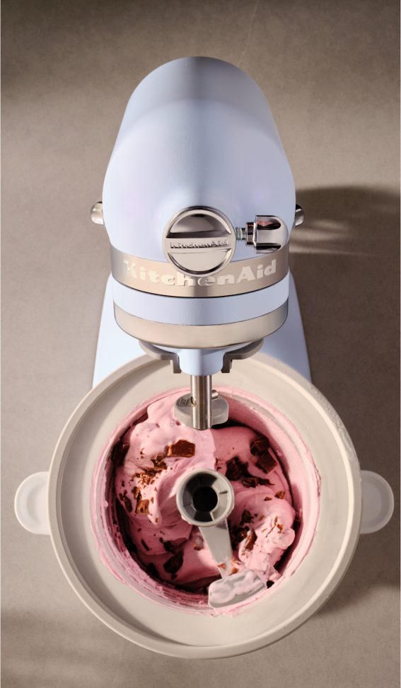 A Blue Salt mixer with pink ice cream in the bowl.