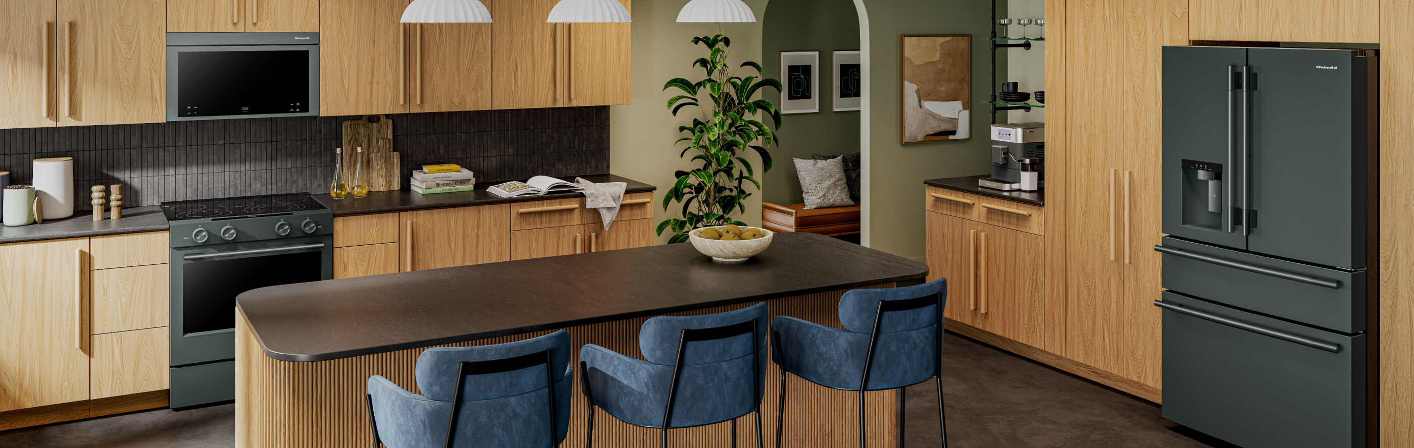 Suite of KitchenAid® Juniper appliances in natural wood cabinetry