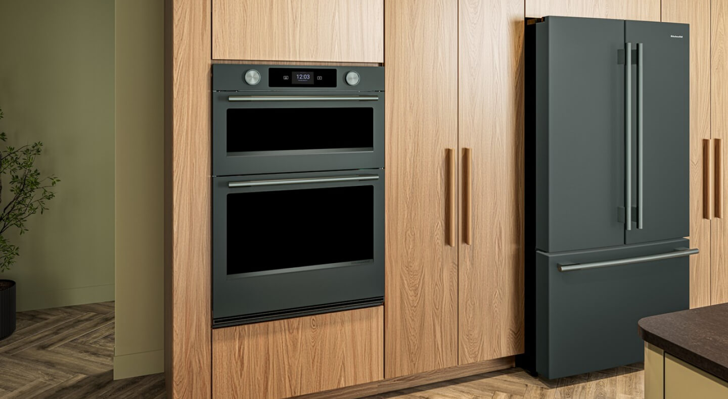 KitchenAid® Juniper combination wall oven and French door refrigerator in wood cabinetry