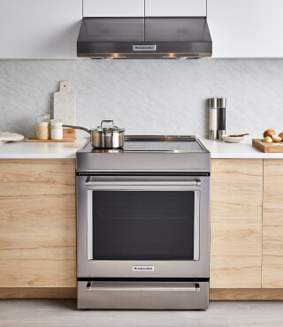 A KitchenAid® range and over-the-range microwave in a modern kitchen