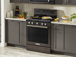 KitchenAid® oven set in gray cabinetry