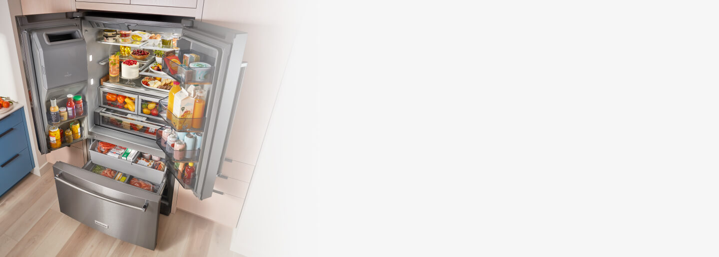 Open French door refrigerator filled with groceries