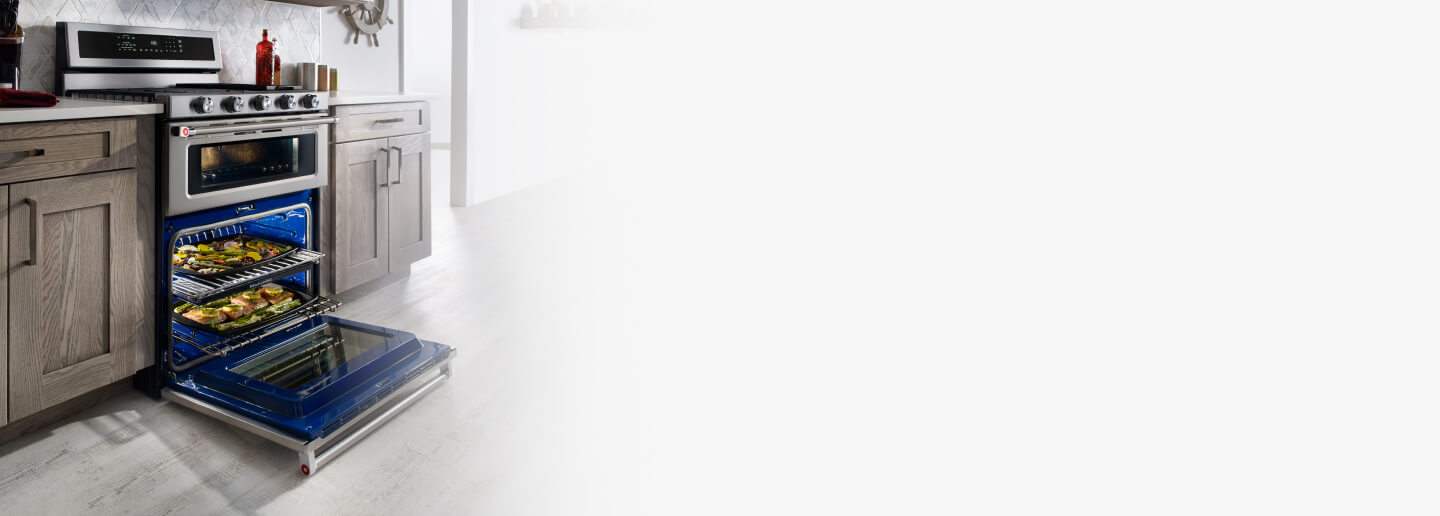 Gas double oven range with open bottom oven door