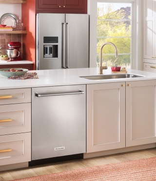 A KitchenAid® dishwasher installed in light brown cabinetry