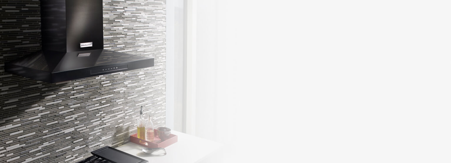 Wall-mount range hood in a contemporary kitchen