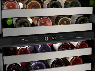 Wine refrigerator filled with bottles of wine