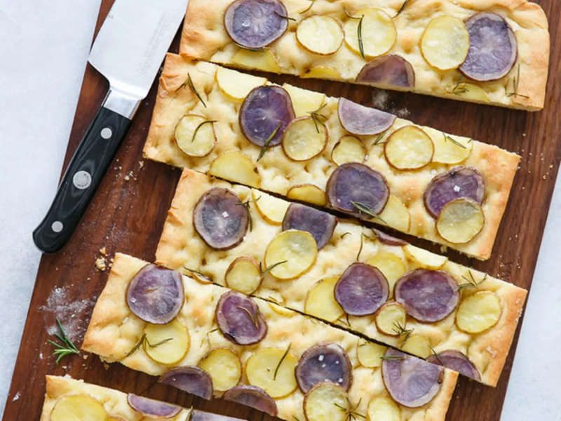 Potato focaccia on cutting board 