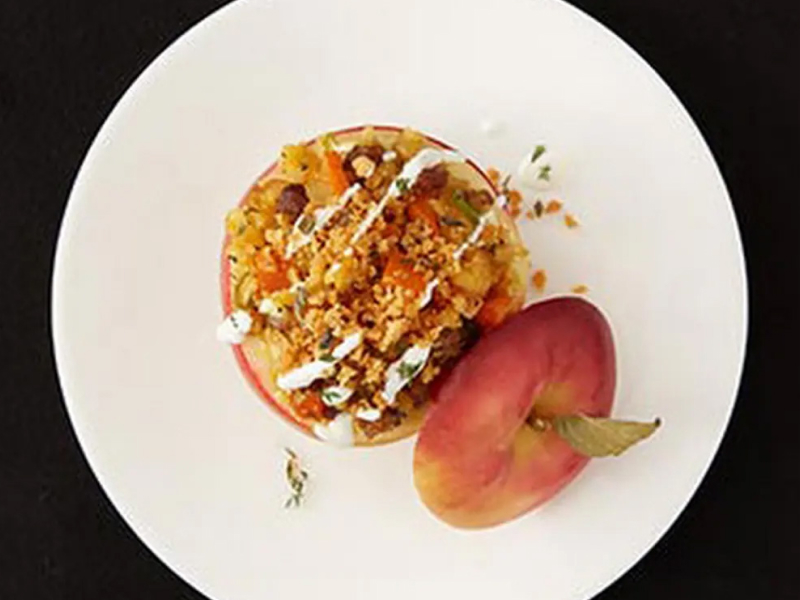 Sweet potato stuffed apple on white plate