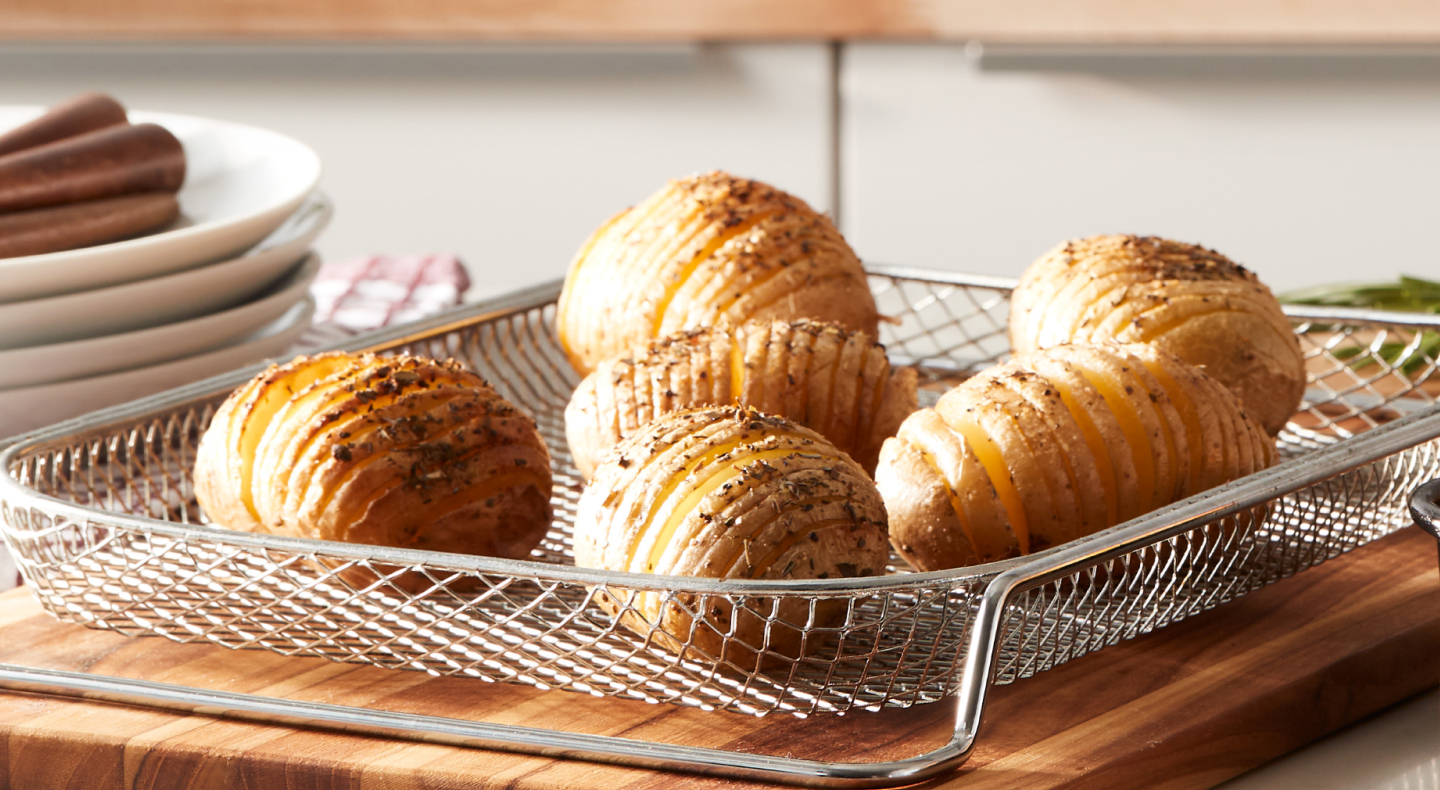 Hasselback potatoes on wire mesh tray  Hasselback potatoes on wire mesh tray