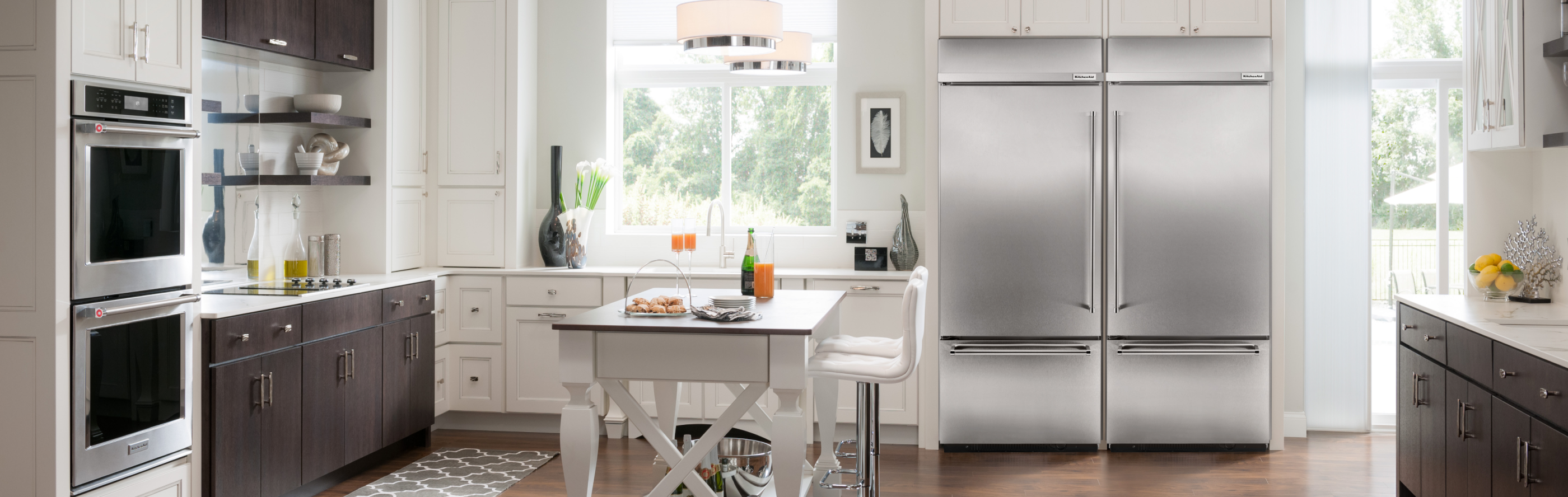 Kitchen with KitchenAid® stainless steel appliances and white cabinets
