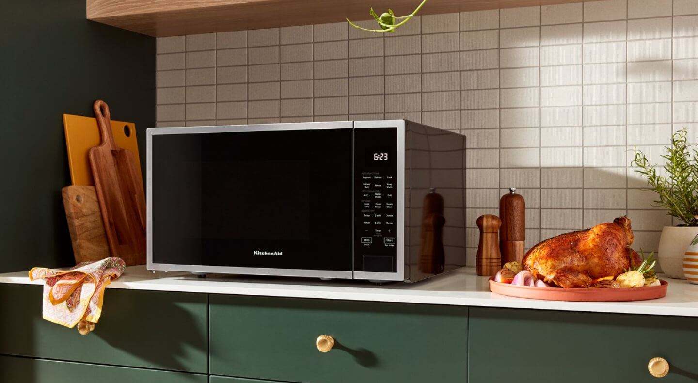 KitchenAid® countertop microwave next to roasted chicken