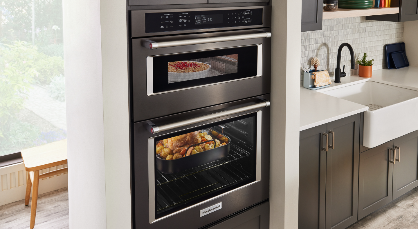 Baked oatmeal dessert and a whole chicken roasting in a KitchenAid® double wall oven