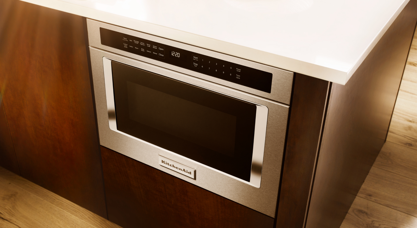 Stainless steel built-in microwave installed in a kitchen island Stainless steel built-in microwave installed in a kitchen island