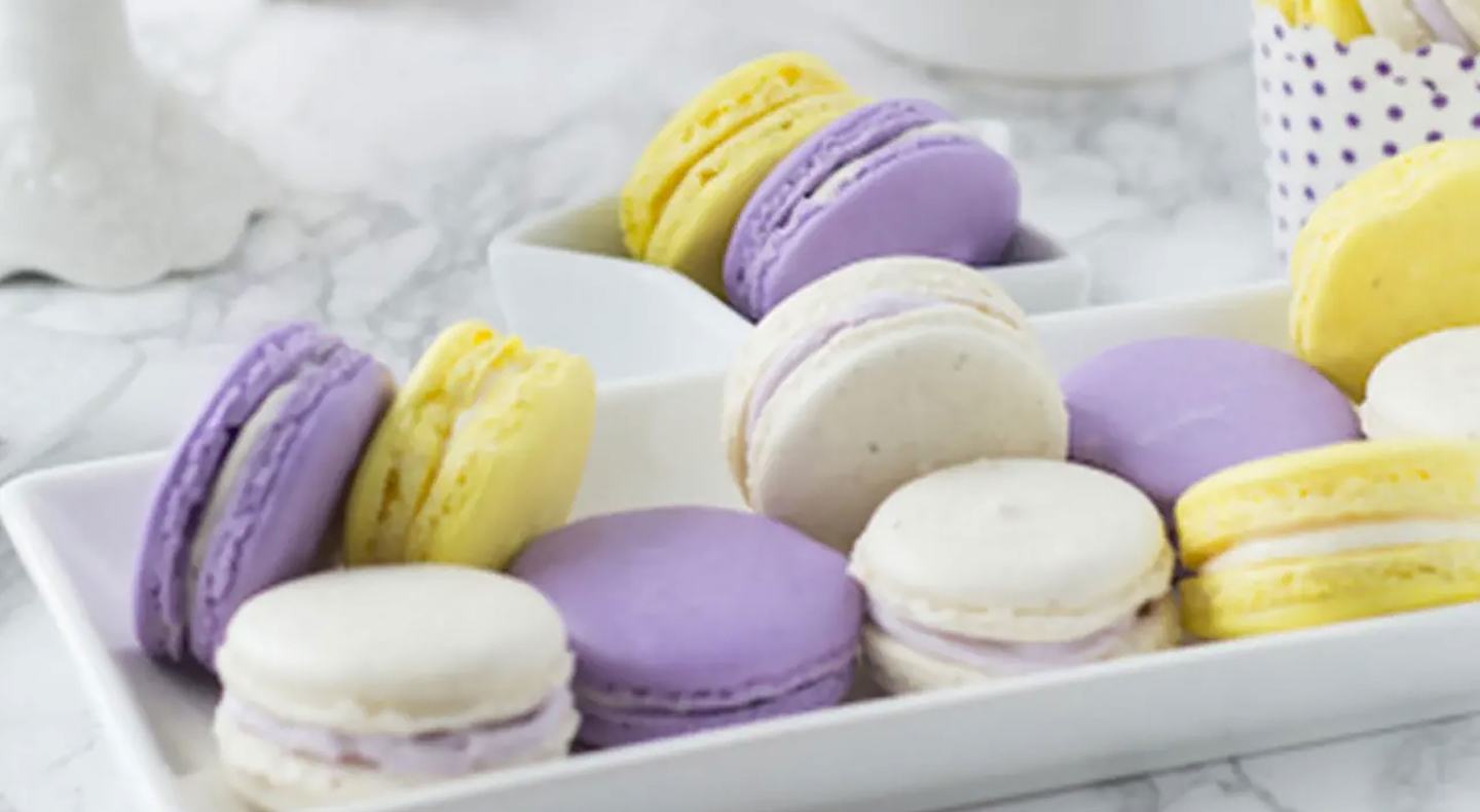 Lavender honey macarons on a serving tray.  Lavender honey macarons on a serving tray.