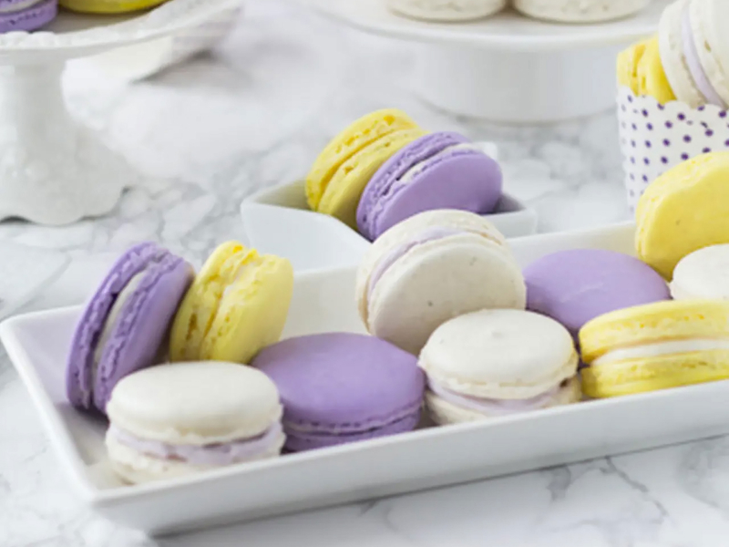 Lavender honey macarons on a serving tray.  Lavender honey macarons on a serving tray.