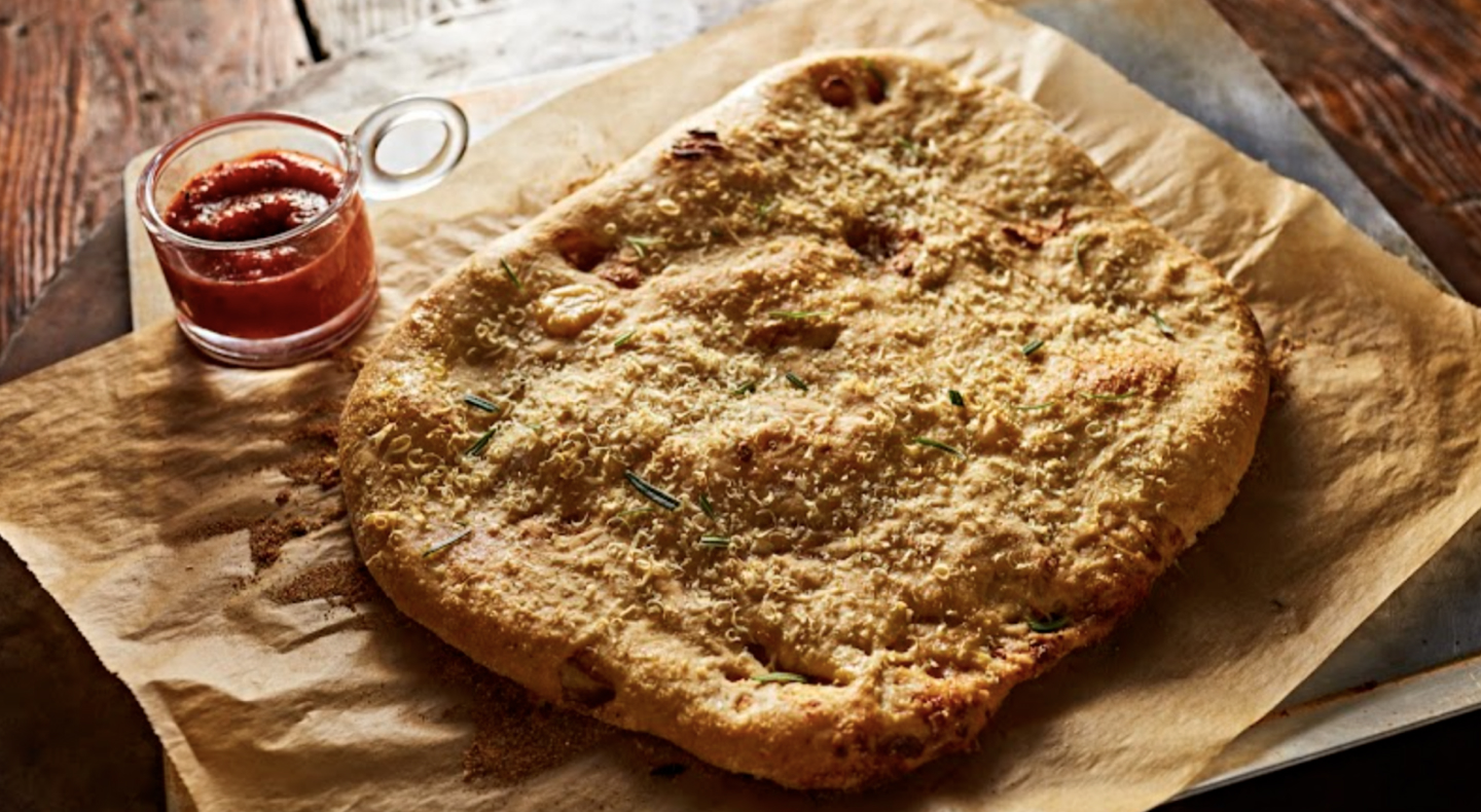 A prepared garlic confit flatbread A prepared garlic confit flatbread