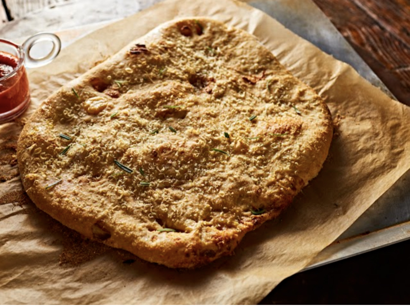 A prepared garlic confit flatbread A prepared garlic confit flatbread