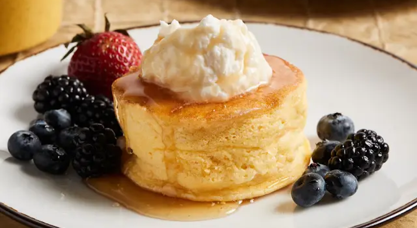 Single-serve souffle on plate with fruit Single-serve souffle on plate with fruit