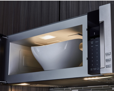 Open microwave with large bowl inside