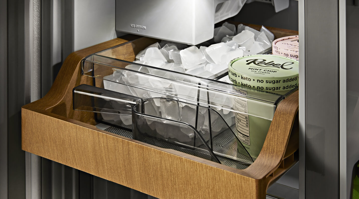 Ice and ice cream inside a wood-paneled ice compartment Ice and ice cream inside a wood-paneled ice compartment