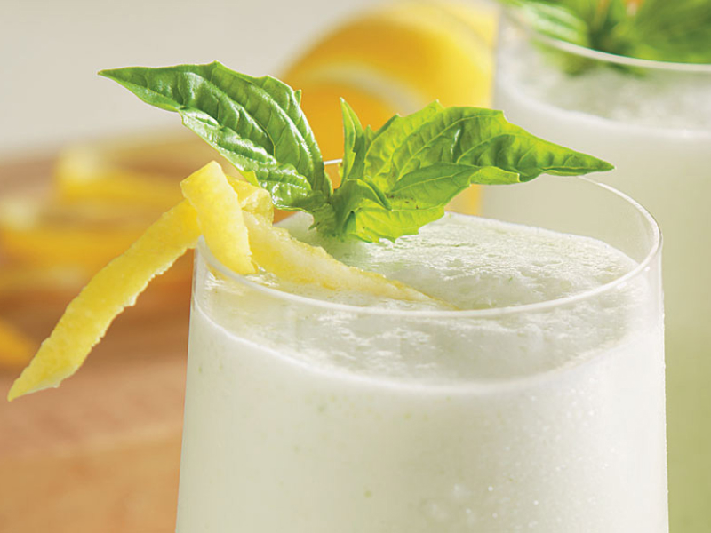 Margaritas with lemon peels and mint on top. Margaritas with lemon peels and mint on top.