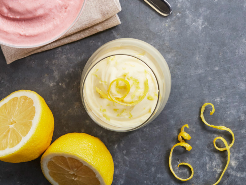 Parfait with lemon peels and whole lemons next to it. Parfait with lemon peels and whole lemons next to it.