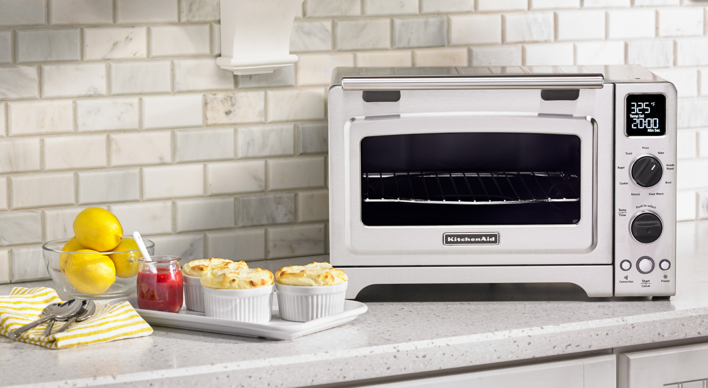 Lemon dessert next to a KitchenAid® countertop oven. Lemon dessert next to a KitchenAid® countertop oven.