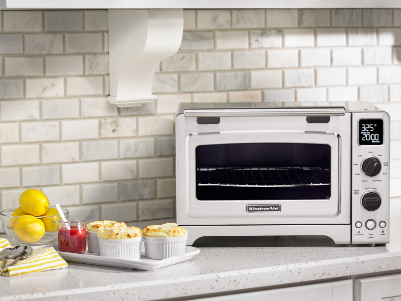 Lemon dessert next to a KitchenAid® countertop oven. Lemon dessert next to a KitchenAid® countertop oven.
