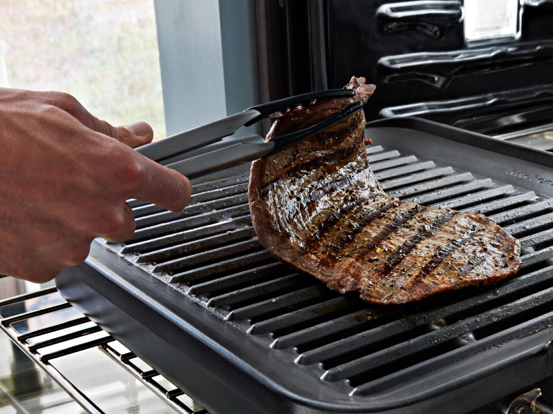 Cooked meat in countertop oven Cooked meat in countertop oven