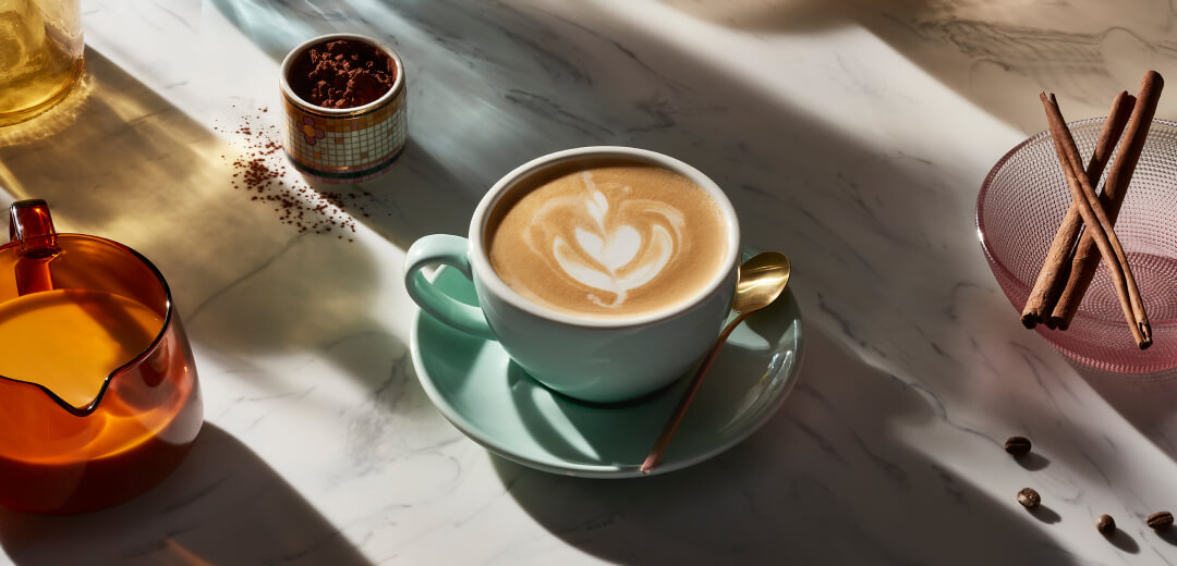 Espresso drink in a teal ceramic mug