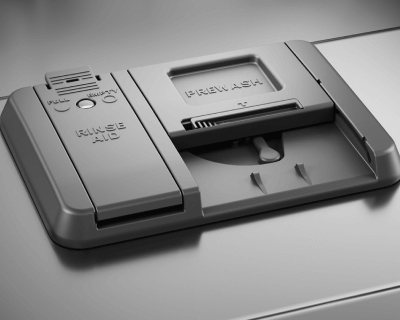 Closed dishwasher detergent dispenser with a slot for prewash and rinse aid