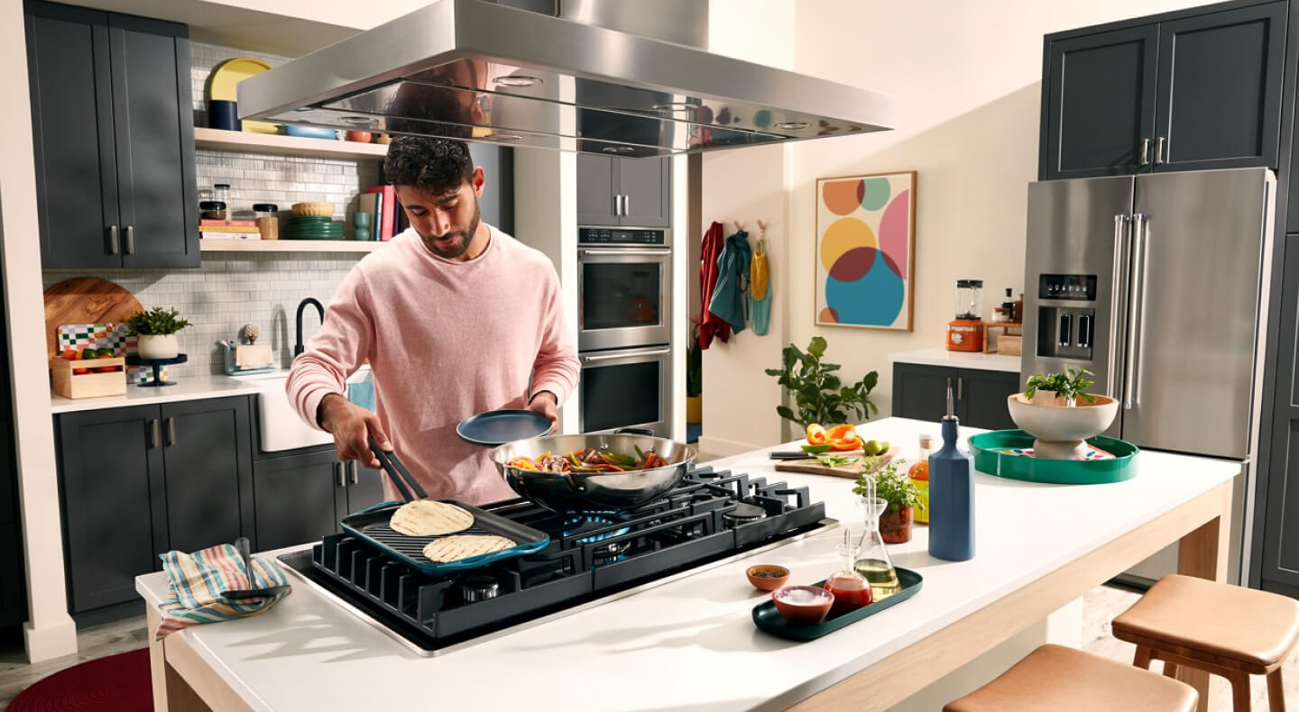 Person making fajitas in a modern kitchen